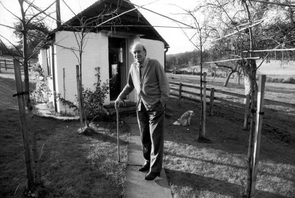 Roald Dahl holding his cane while standing outside of the shed where he wrote in Great Missenden, Buckinghamshire, England.<span class="copyright">Ian Cook—The LIFE Images Collection/Getty Images</span>