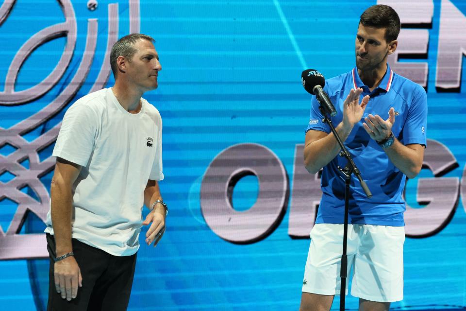 Novak Djokovic, pictured here paying his respects to Jonathan Erlich after their withdrawal from the doubles at the Tel Aviv Open.