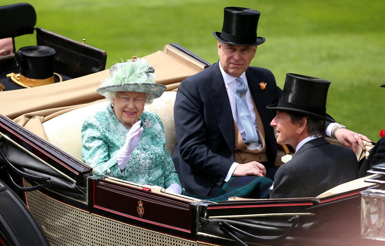 Hats off: The Queen and Prince Andrew lead a carriage procession: PA