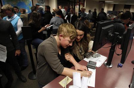 Elenor Heyborne (L) and her partner Marina Gomberg apply for a marriage license at the Salt Lake County Clerks office in Salt Lake City, Utah, December 20, 2013. REUTERS/Jim Urquhart