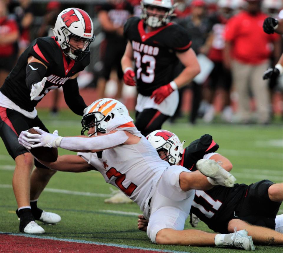 Anderson senior Brodey Berg scores a touchdown run in the first quarter during a football game with Anderson playing at Milford Sept. 8, 2023 at Milford High School.