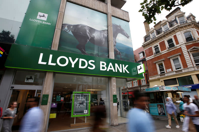 FILE PHOTO: People walk past a branch of Lloyds Bank on Oxford Street in London, Britain July 28, 2016. REUTERS/Peter Nicholls/File Photo