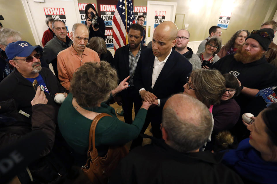 2020 Democratic presidential candidate Sen. Cory Booker talks with an audience member during a meeting with local residents, Saturday, March 16, 2019, in Ottumwa, Iowa. (AP Photo/Charlie Neibergall)