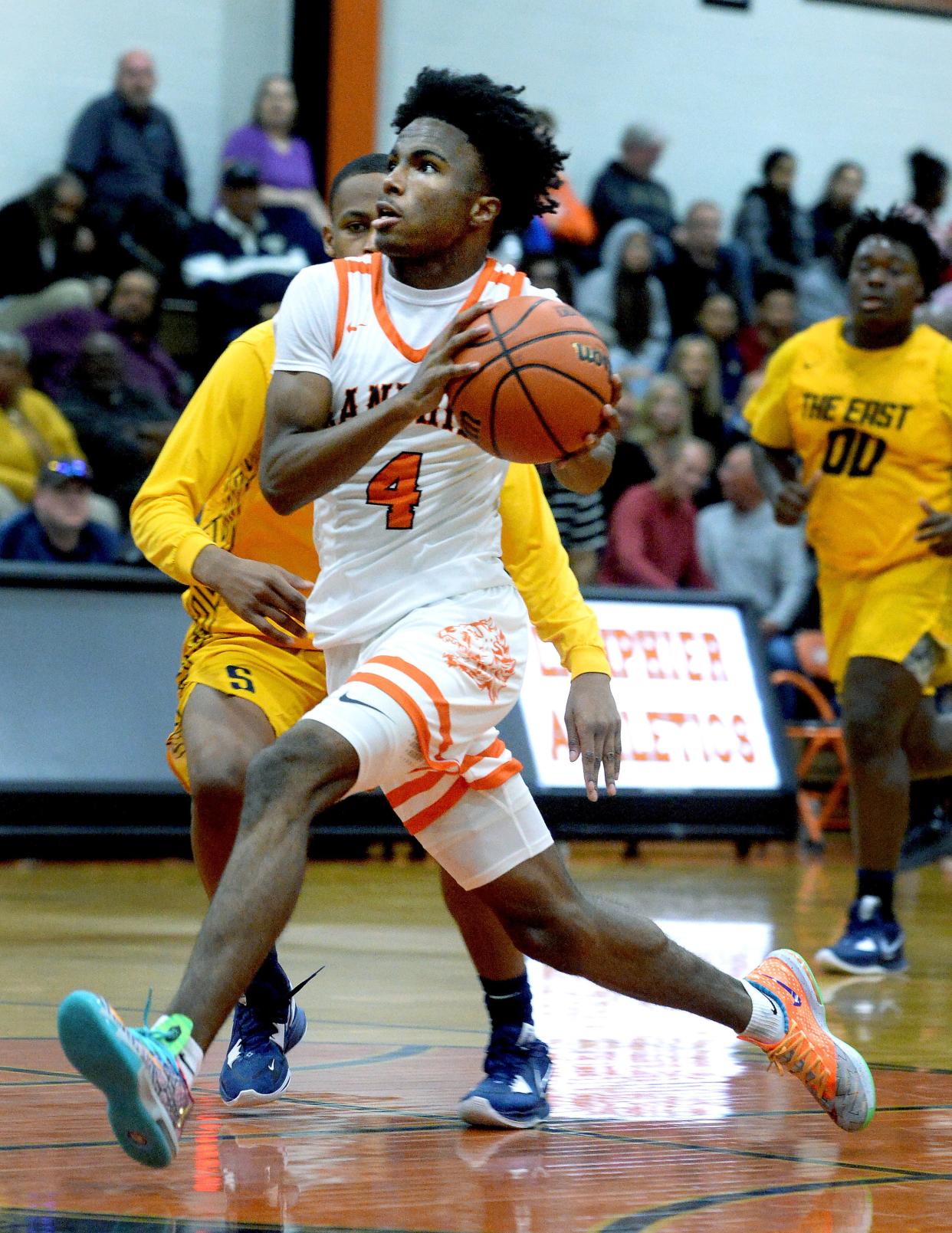 Lanphier's Jaiquan Holman drive toward the basket during the game against Southeast High School Tuesday Dec. 6, 2022.