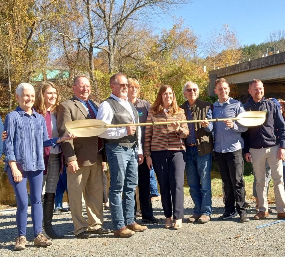 Holding the "Golden Paddle" at the dedication of the new Lackawaxen River Access Park in White Mills, Oct. 27, 2023, are from left: Molly Rodgers, Lackawaxen River Trails; Sen. Rosemary Brown; Rep. Joe Adams; Wayne County Commissioner Brian Smith; Cindy Adams Dunn, secretary, Pennsylvania Department of Conservation and Natural Resources; Sen. Lisa Baker; Grant Genzlinger, Lackawaxen River Trails; Jayson Wood, Woodland Design Associates; and Tim Schaeffer, executive director, Pennsylvania Fish and Boat Commission.