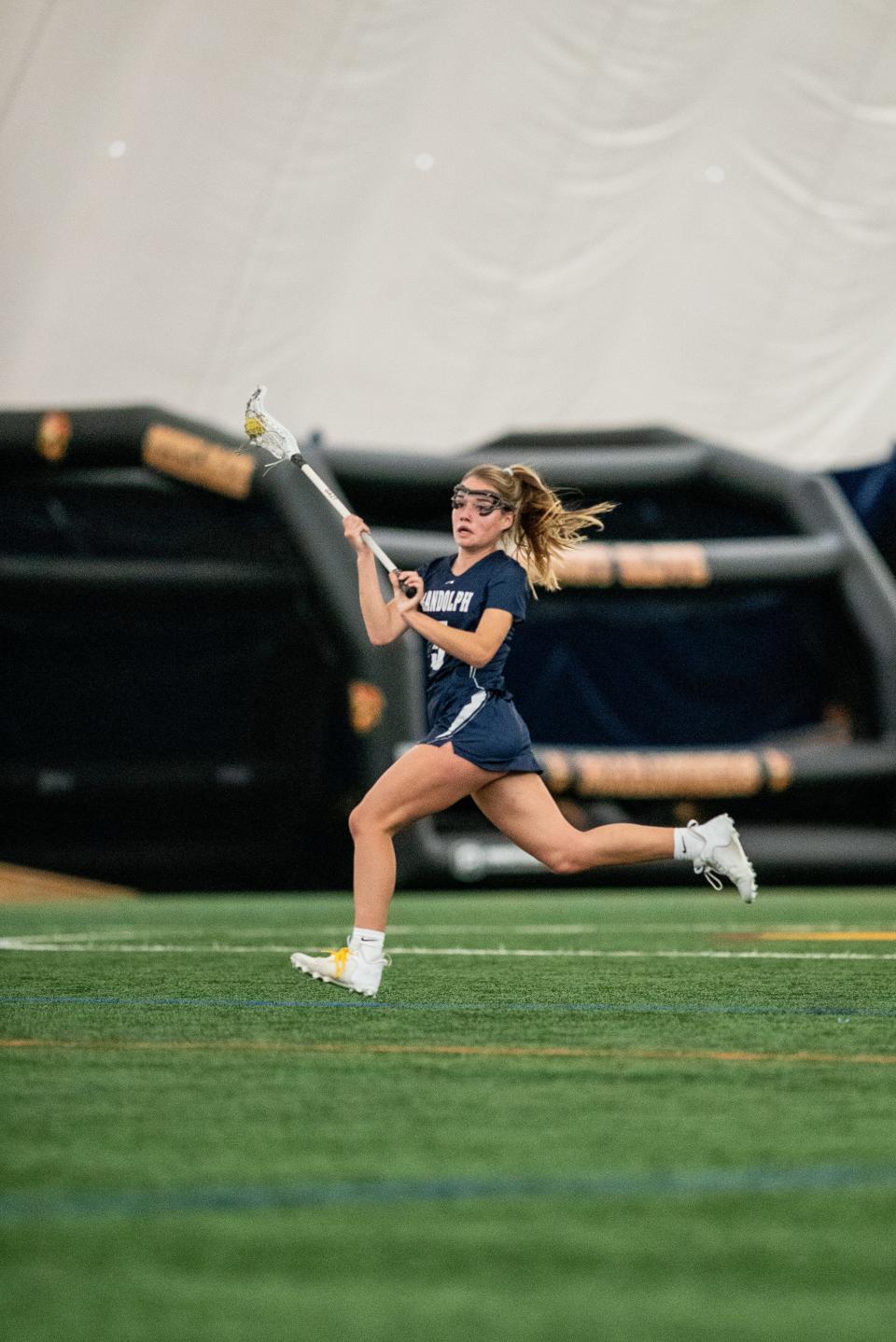 Mount Olive hosts Randolph in a NJIGLL Freedom North girls lacrosse game in Mount Olive on April 26, 2022. R #5 Alexis Rodell with the ball. 