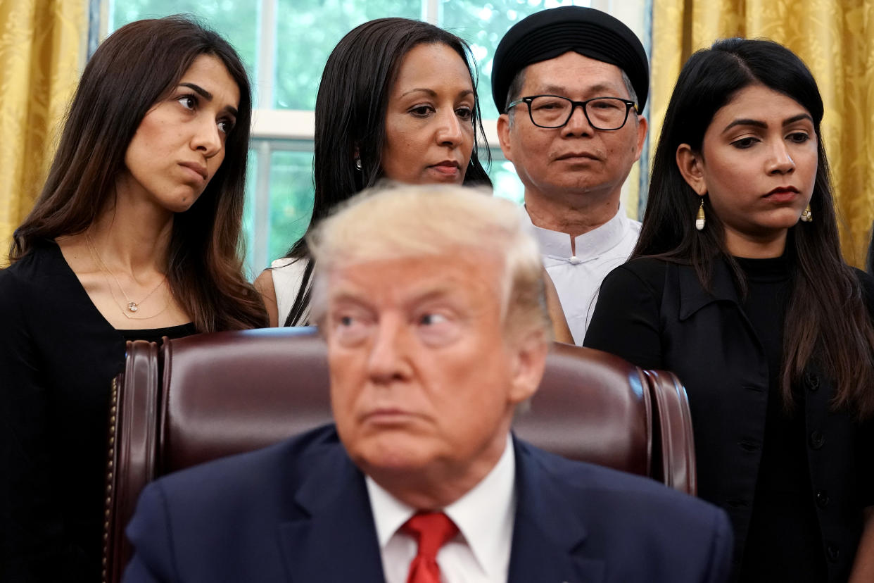 WASHINGTON, DC - JULY 17: U.S. President Donald Trump hosts survivors of religious persecution from 17 countries around the world, including Iraqi Yazidi human rights activist and Nobel Peace Prize winner Nadia Murad (L), in the Oval Office at the White House July 17, 2019 in Washington, DC. The survivors are in Washington to attend a State Department conference on religious freedom. (Photo by Chip Somodevilla/Getty Images)