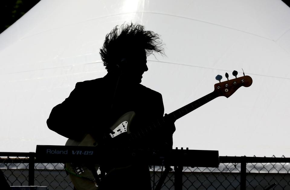 In this 2019 file photo, Ray McGale, with the band Color Tongue has his hair flying high as he gets into his performance during the 15th annual Pleasantville Music Festival at Parkway Field in Pleasantville.