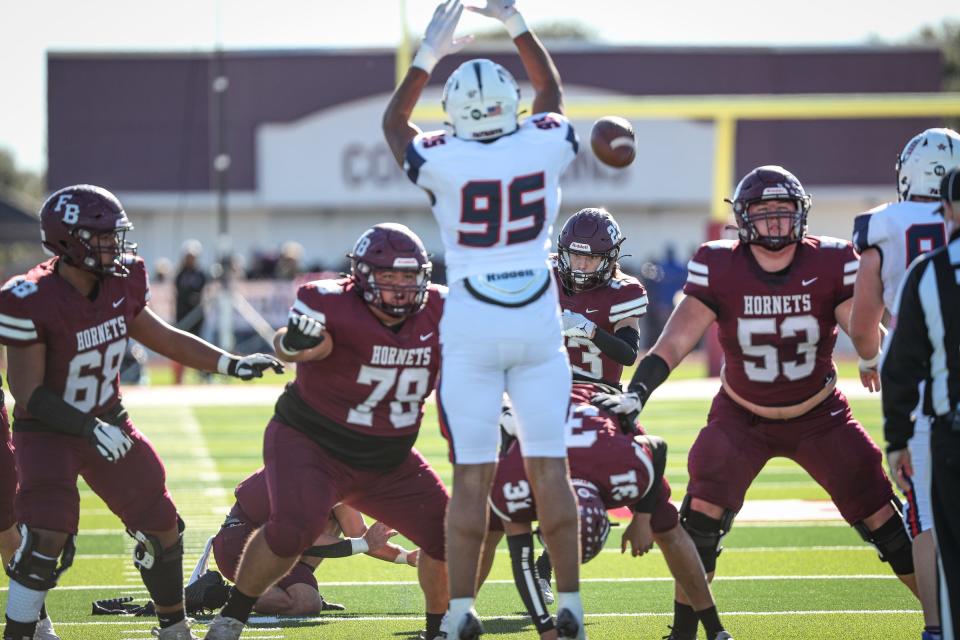 Flour Bluff's Kyler Meschi kicks a field goal at Hornet Stadium during the Class 5A Division II regional round on Nov. 26, 2022, in Corpus Christi, Texas.