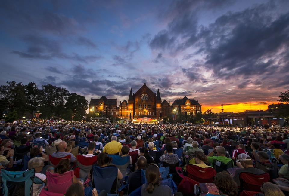 The sun sets over Music Hall during the 2015 Lumenocity concert at Washington Park in Over-the-Rhine.