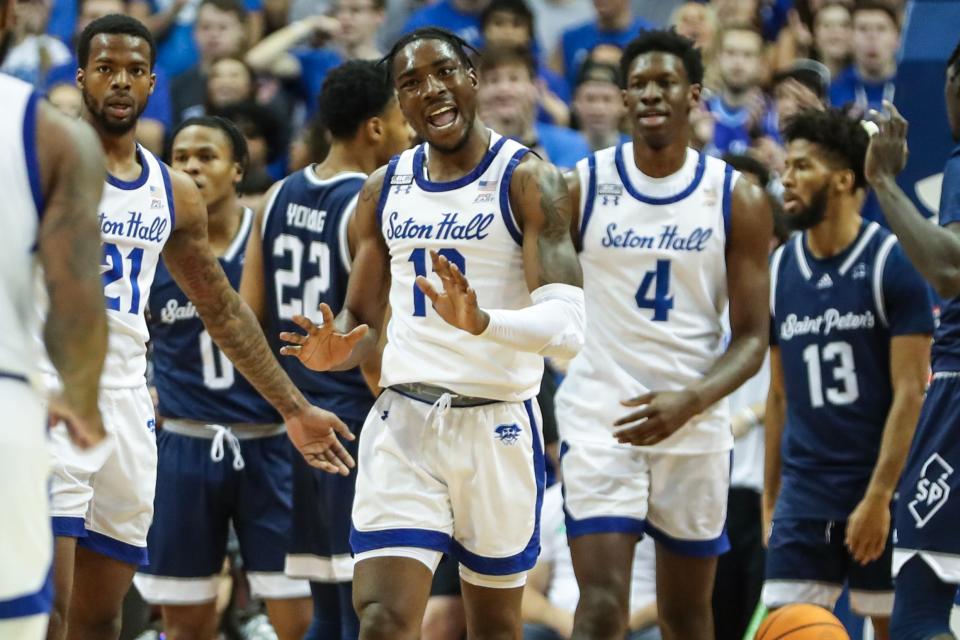 Seton Hall Pirates forward KC Ndefo (13) reacts after scoring and being fouled in the first half against the St. Peter's Peacocks on at Prudential Center.