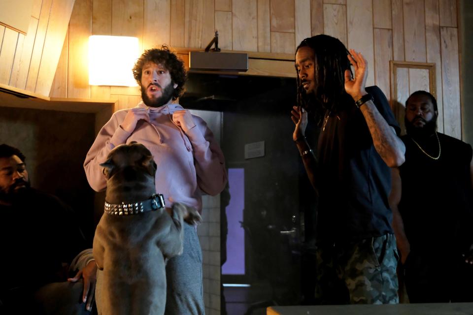 Even a dog can smell the fear on Dave (Dave Burd), left, as he hopes to impress a rapper and his entourage as friend GaTa (GaTa) looks on in the series premiere of FXX's "Dave."