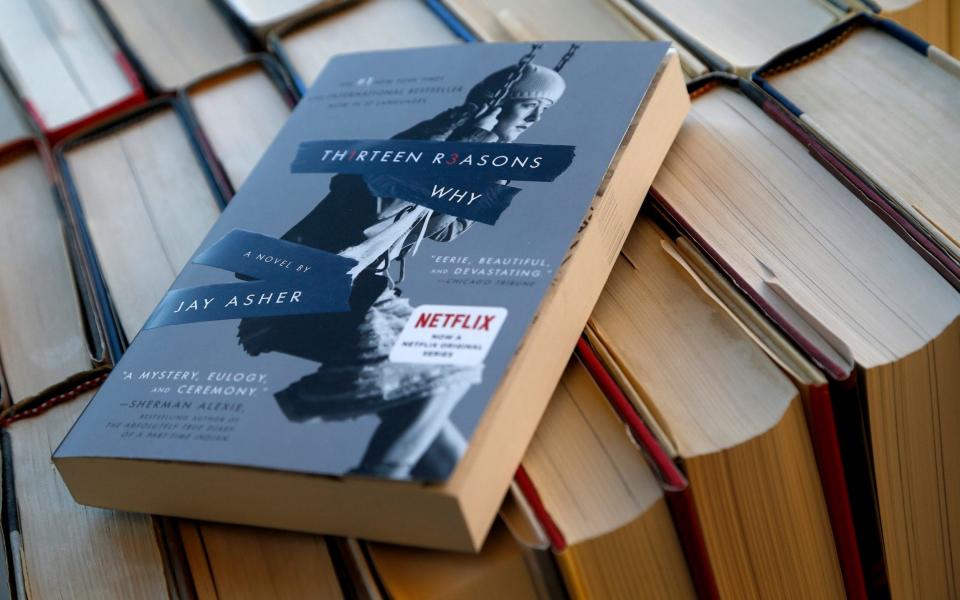 One top school district official in Colorado ordered librarians to temporarily stop circulating the book that's the basis for the series after the death of seven students - Credit: AP