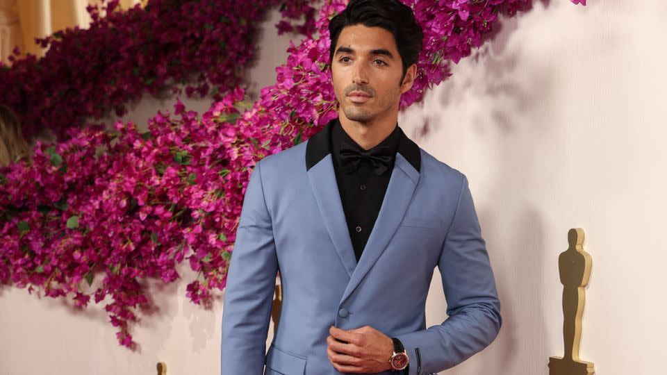 Taylor Zakhar Perez popped on the red carpet with a blue Prada suit styled by leading celebrity stylist Jason Bolden. He paired the look with a Vacheron Constantin watch. - David Swanson/AFP/Getty Images