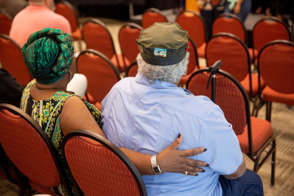 Loved ones of Presley Eze hold one another during a news conference on Tuesday, Oct. 3, 2023, at the Las Cruces Convention Center. Attorney General Raúl Torrez announced charges against LCPD officer, Brad Lunsford, for the death of Presley Eze.