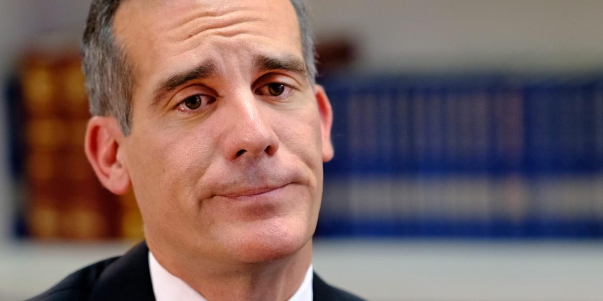 Los Angeles Mayor Eric Garcetti smirks.