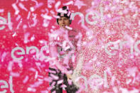 Slovenia's Tadej Pogacar, wearing the pink jersey of the race overall leader, celebrates on podium after completing the 10th stage of the Giro d'Italia, Tour of Italy cycling race from Pompei to Cusano Mutri, Italy, Tuesday, May 14, 2024. (Gian Mattia D'Alberto/LaPresse via AP)