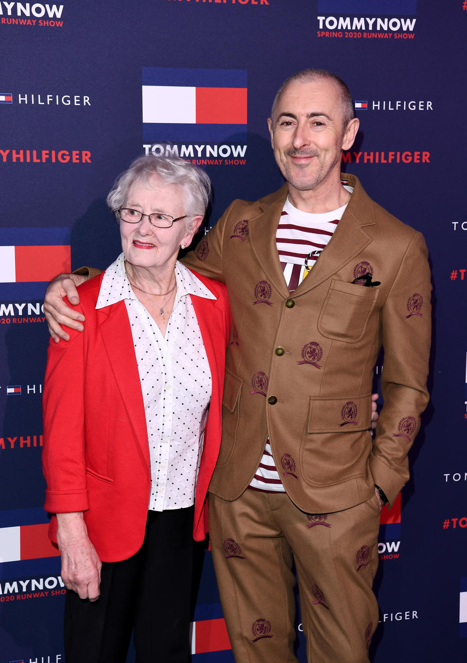 LONDON, ENGLAND - FEBRUARY 16: Alan Cumming and mother Mary Darling attend the TommyNow show during London Fashion Week February 2020 at the Tate Modern on February 16, 2020 in London, England. (Photo by Jeff Spicer/BFC/Getty Images for BFC)