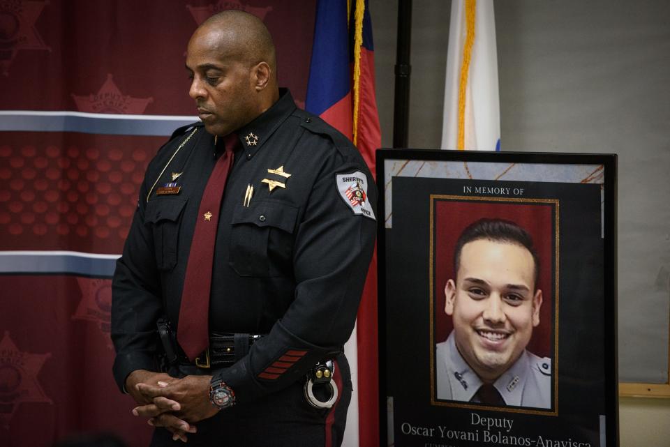 Cumberland County Sheriff Ennis Wright stands by a picture of Cumberland County Sheriffs Deputy Oscar Yovani Bolanos-Anavisca Jr., 23, during a press conference on Friday, Dec. 16, 2022. Bolanos-Anavisca was struck and killed by an impaired driver on Gillespie Street early Friday.