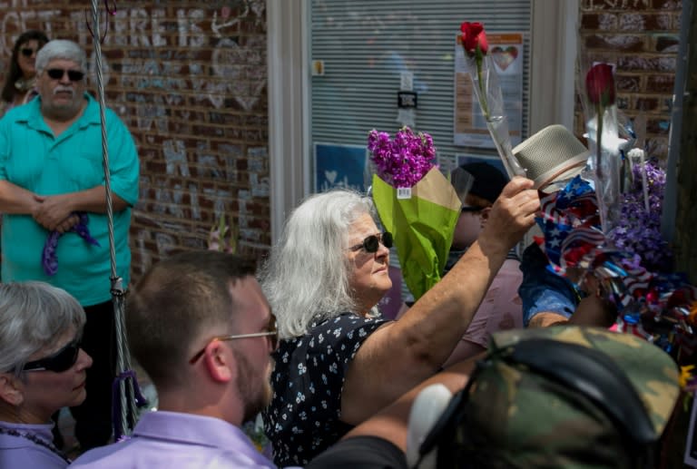 On the first anniversary of the death of Heather Heyer, her mother Susan Bro layed flowers at the spot of her daughter's killing in Charlottesville in memory of the Virginia state troopers who died during the unrest