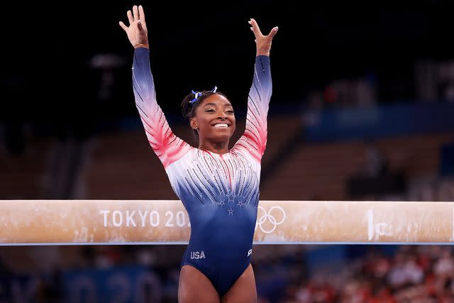 <p>Laurence Griffiths/Getty</p> Simone Biles of Team United States competes in the Women's Balance Beam Final on day eleven of the Tokyo 2020 Olympic Games at Ariake Gymnastics Centre on August 03, 2021