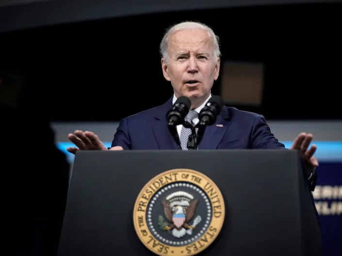 President Joe Biden speaks at a podium