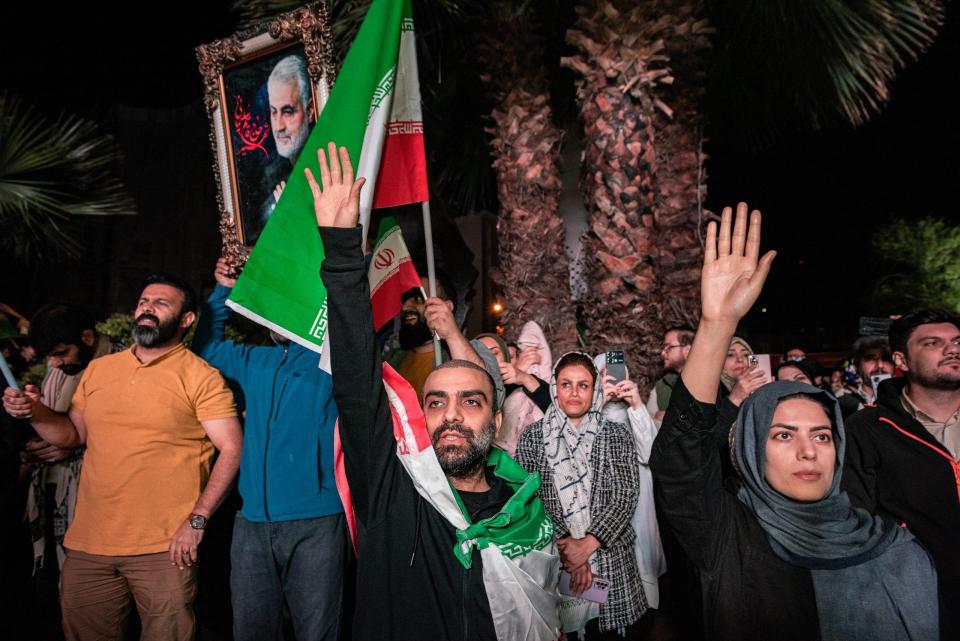 Iranian pro-government supporters shout anti-Israel slogans at Palestine Square in Tehran.