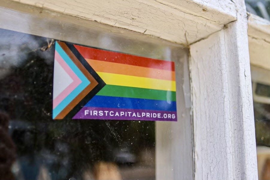 The Progress Pride Flag was designed by Graphic Designer Daniel Quasar in 2018 to place greater emphasis on "inclusion and progression." The update added a five-colored chevron to the rainbow flag including black and brown stripes to represent marginalized people of color in the LGBTQ community along with pink, light blue, and white stripes to represent the Transgender Pride Flag.