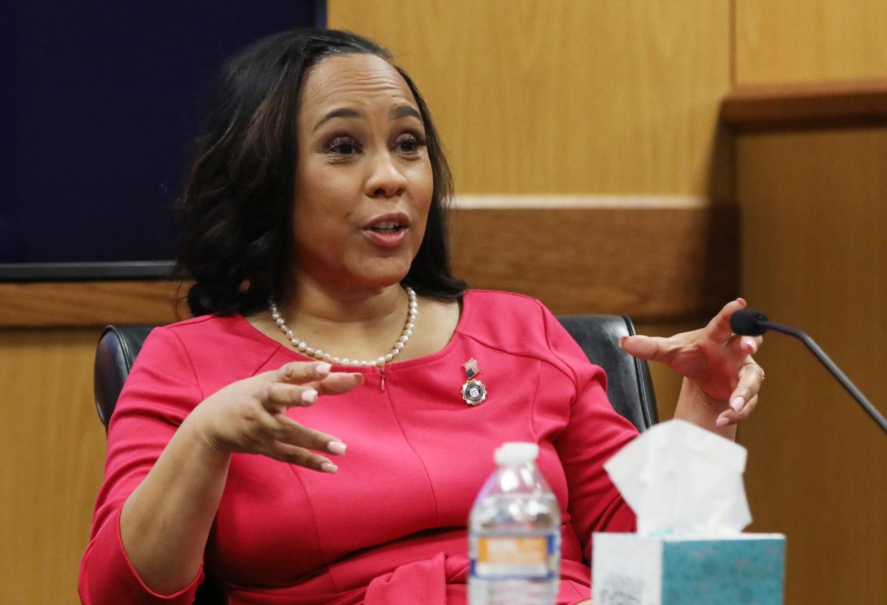 Attorney Fani Willis speaks from a witness stand during a hearing in the case of State of Georgia v. Donald John Trump at the Fulton County Courthouse in Atlanta, Georgia, U.S., February 15, 2024.