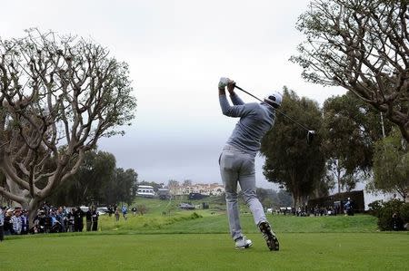 February 19, 2017; Pacific Palisades, CA, USA; Dustin Johnson hits from the ninth hole tee box during the continuation of third round play in the Genesis Open golf tournament at Riviera Country Club. Mandatory Credit: Gary A. Vasquez-USA TODAY Sports