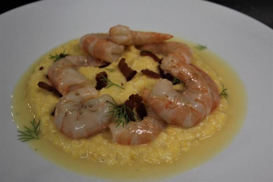 Shrimp and grits is pictured, as made by Chef Alex Perry of Vestige in Ocean Springs.