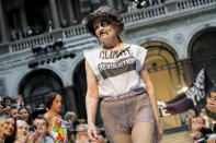 British designer Vivienne Westwood receives applause during London Fashion Week, Sunday, Sept. 16, 2012. (AP Photo/Jonathan Short)