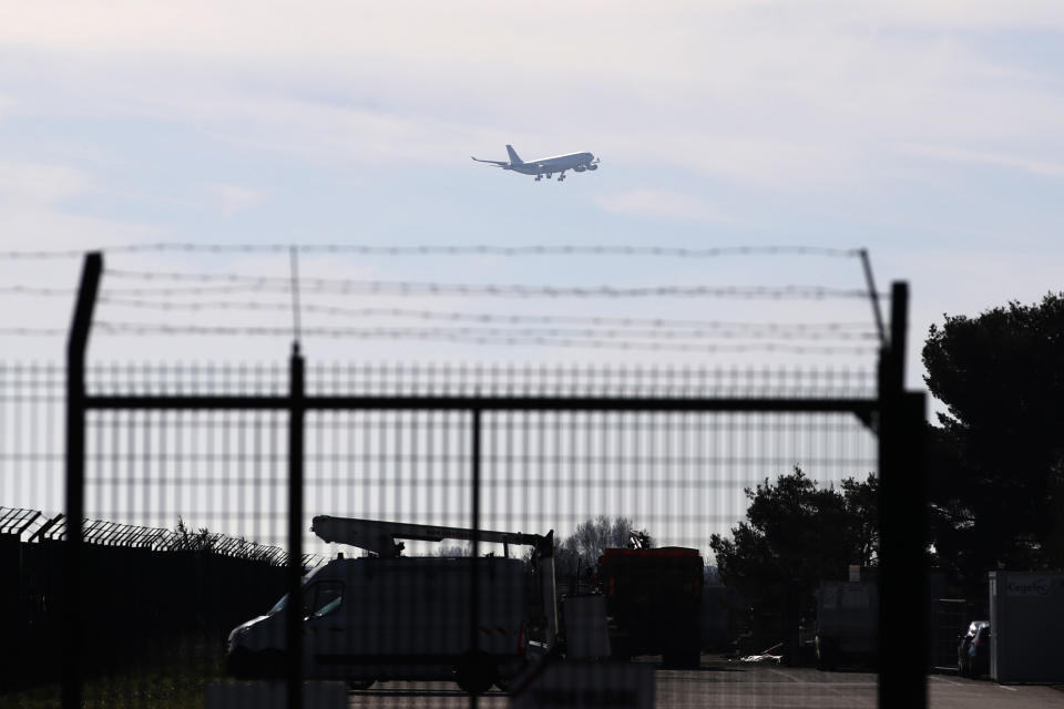 The plane carrying European passengers escaping Wuhan prepares to land at the military air base in Istres, southern France, Friday Jan.31, 2020. The passengers will be kept in quarantine for 14 days and will be put up at a southern vacation resort of Carry-le-Rouet. (AP Photo/Daniel Cole)