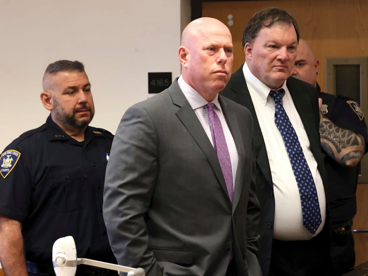 Rex Heuermann appears next to his attorney Michael Brown at Suffolk County Court in Riverhead, New York, on Wednesday 17 April 2024 (AP)