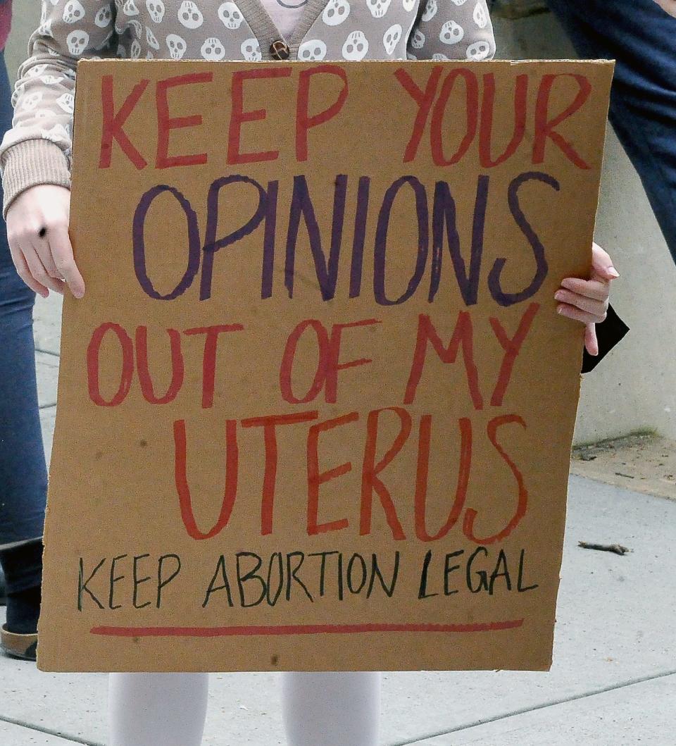 Many signs were displayed at the College of Wooster campus Thursday that expressed outrage at a leaked U.S. Supreme Court opinion that would overturn Roe v. Wade.