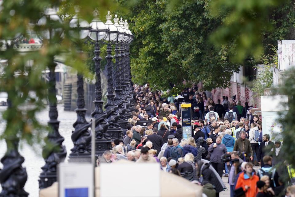 Members of the public wait in the queue near Lambeth Bridge in central London, to view Queen Elizabeth II lying in state (Danny Lawson/PA) (PA Wire)
