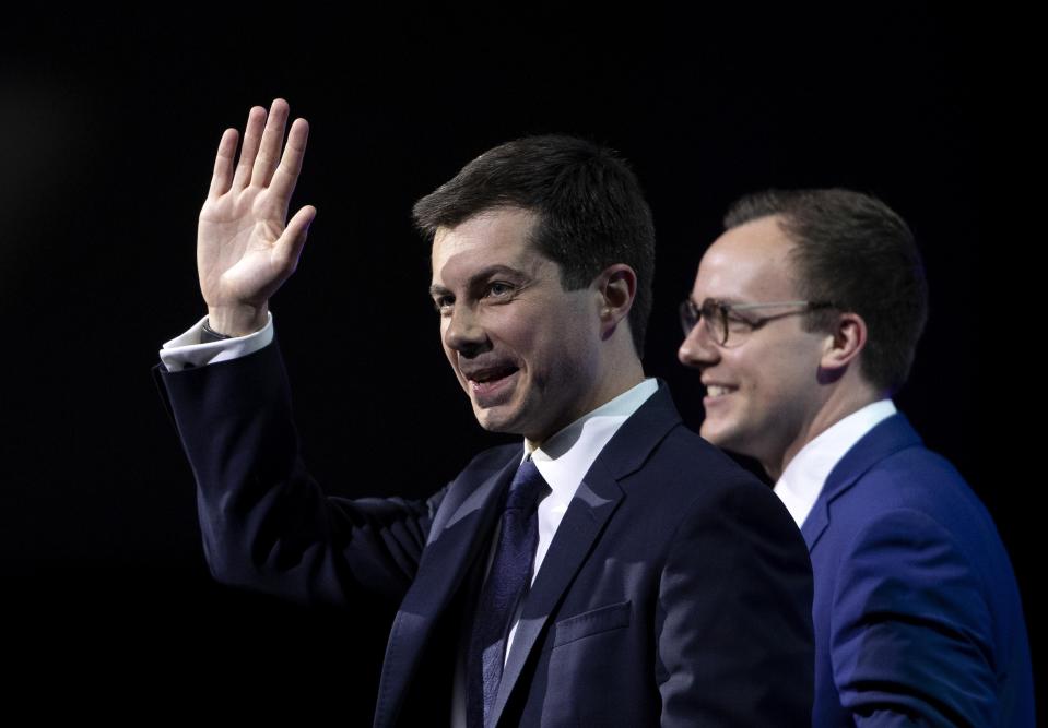Democratic presidential candidate Pete Buttigieg, left, is joined onstage by his husband Chasten Glezman Buttigieg after speaking during the Human Rights Campaign's 14th Annual Las Vegas Gala at Caesars Palace in Las Vegas, Saturday, May 11, 2019. (Steve Marcus/Las Vegas Sun via AP)