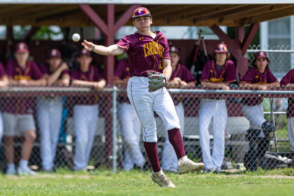 Case’s Jacob Poitras throws to first base during last season's MIAA Division 4 playoff action against Bay Path.