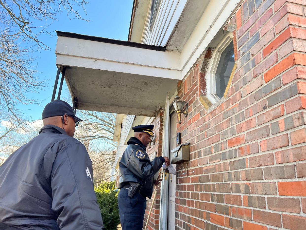 Detroit Police Chief James White goes door to door on Memorial Street on March 29, 2023, the same street where an 80-year-old woman was sexually assaulted outside of her home just days prior, and passed out flyers with a sketch of the suspect.