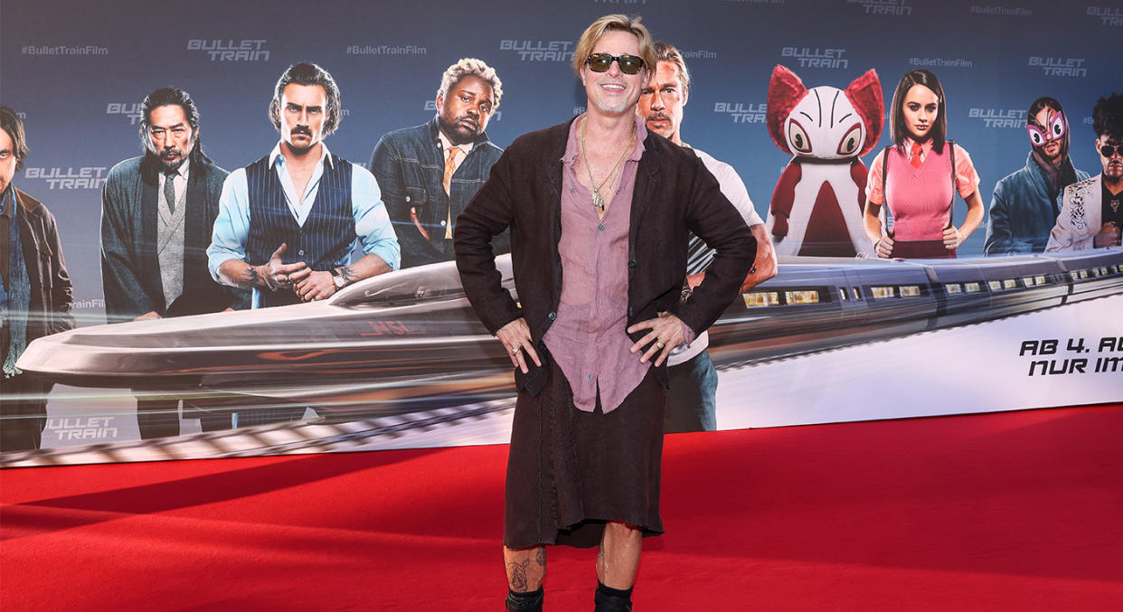 Brad Pitt wearing a skirt on the red carpet 