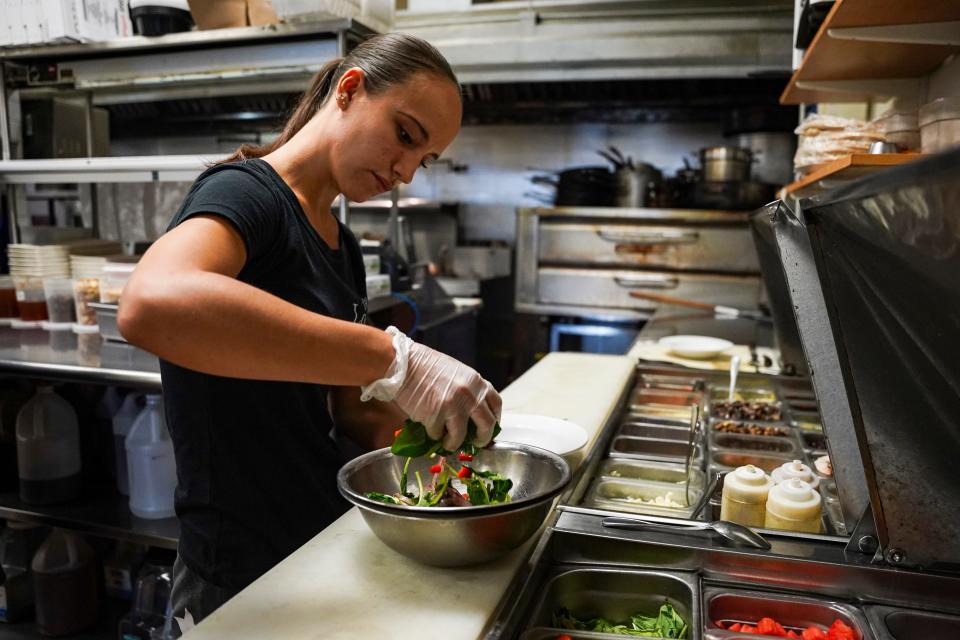 Sarah Kurz prepares a watermelon salad at The Local in Naples on April 11, 2023.