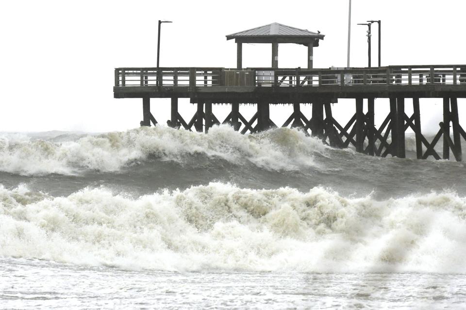 Heavy waves come ashore near the Oak Island Beach Pier Sept. 30, 2022 in Oak Island, N.C. Oak Island is nominated for USA TODAY 10Best Readers' Choice 2024 best beach in North Carolina.