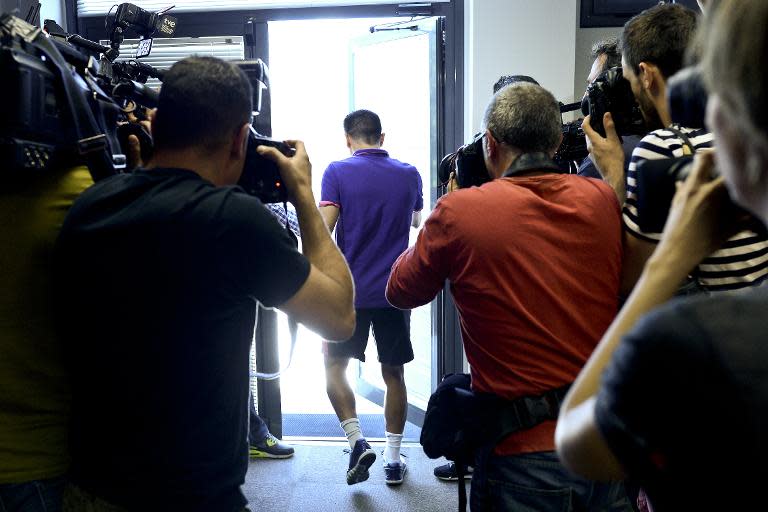 Barcelona's Xavi Hernandez leaves after a press conference to announce his departure from the club on May 21, 2015