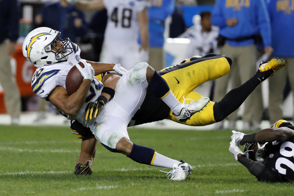 Pittsburgh Steelers linebacker L.J. Fort, rear, tackles Los Angeles Chargers running back Austin Ekeler (30) during the second half of an NFL football game in Pittsburgh, Sunday, Dec. 2, 2018. The Chargers won 33-30. (AP Photo/Gene J. Puskar)