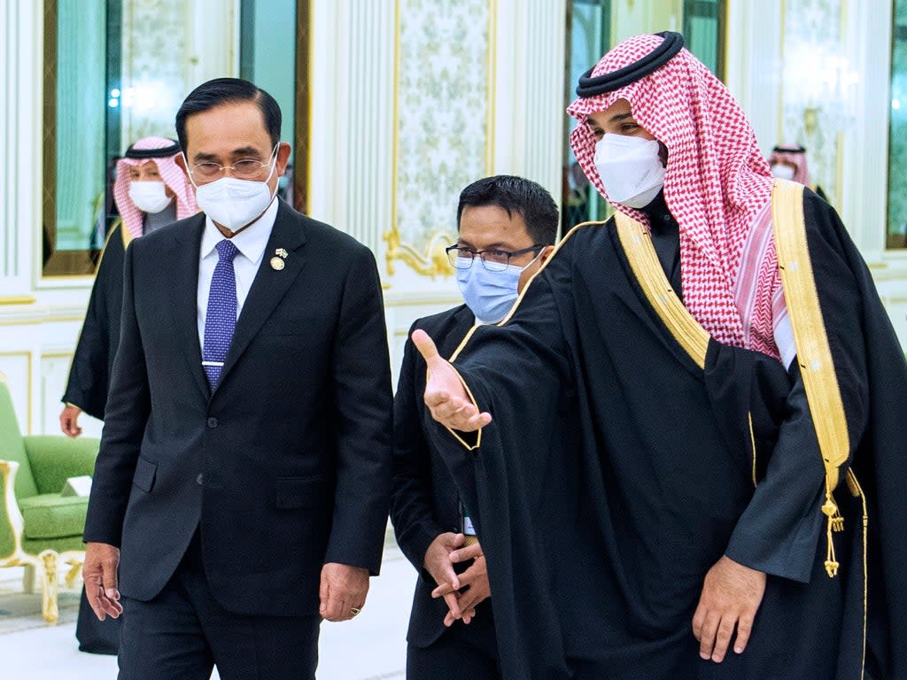 Saudi crown prince Mohammed bin Salman, right, welcomes Thai prime minister Prayuth Chan-ocha, at the royal palace in Riyadh (AP)