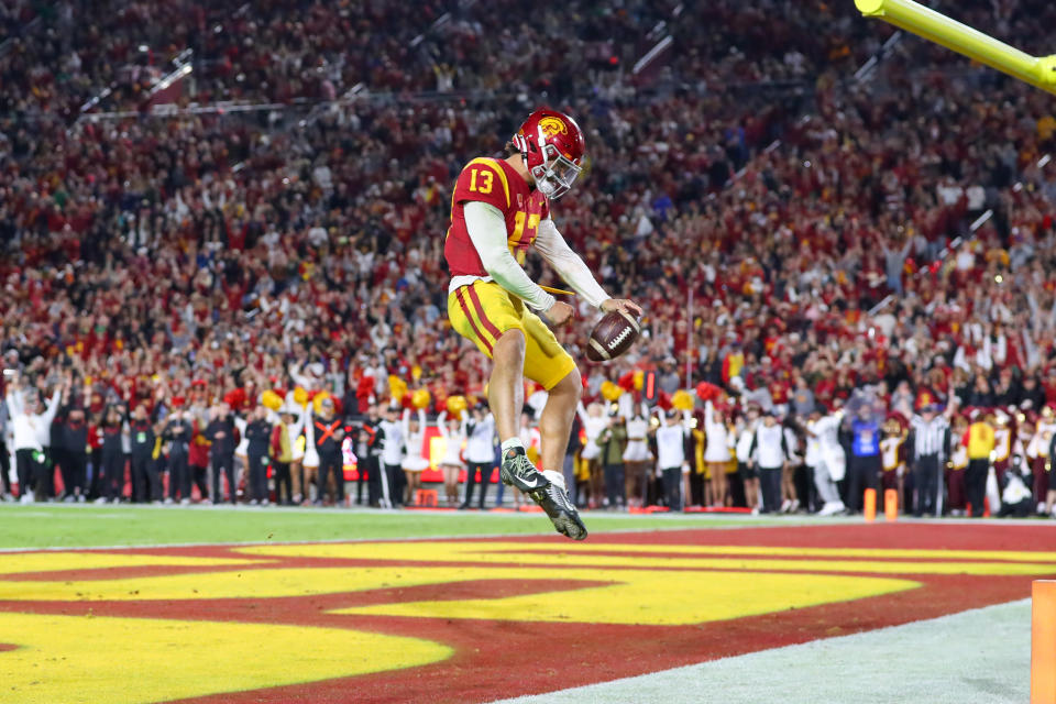 LOS ANGELES, CA - NOVEMBER 26: USC Trojans quarterback Caleb Williams (13) celebrates in the end zone after a scoring touchdown during a college football game between the Notre Dame Fighting Irish against the USC Trojans on November 26, 2022, at United Airlines Field at The Los Angeles Memorial Coliseum in Los Angeles, CA. (Photo by Jordon Kelly/Icon Sportswire via Getty Images)