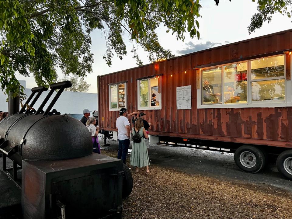 Parked in West Palm Beach's hip SoSo district, the Austin Republic mobile kitchen is expected to open in May. Acclaimed chef Jimmy Strine (at window), who heads the kitchen, recently tested the menu for locals.