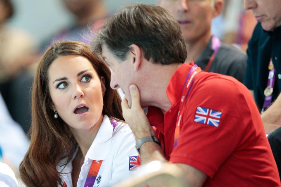 <p>Kate shares her shock with Robin Cousins, team Great Britain's official ambassador, during the women's synchronized swimming competition at the London Olympics.<br></p>