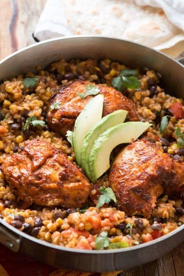 <strong>Get the <a href="https://ohsweetbasil.com/fiesta-chicken-and-rice-recipe/" target="_blank">Fiesta Chicken and Rice</a> recipe from Oh Sweet Basil</strong>
