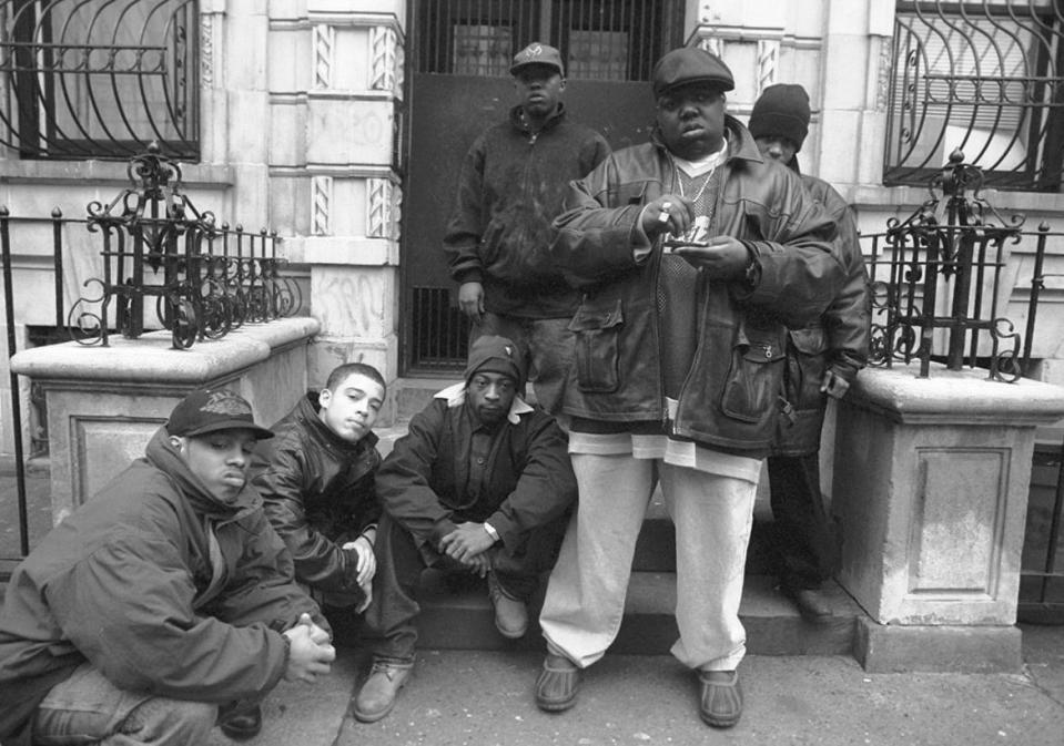 <div class="inline-image__caption"><p>Rapper Notorious B.I.G., aka Biggie Smalls, aka Chris Wallace with Junior Mafia outside his mother's house in Brooklyn. </p></div> <div class="inline-image__credit">Clarence Davis/New York Daily News Archive</div>